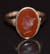 A 9ct rose gold ring set with a carved carnelian agate intaglio, 2g, size J