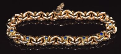 Edwardian 15ct rose gold curb link bracelet set with sapphires, 22.5g 26cm