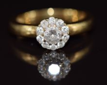 An 18ct gold ring set with diamonds in a cluster, total diamond weight approximately 0.5ct, 5.3g,