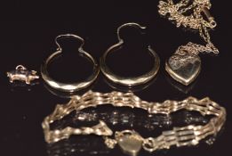A 9ct gold gate bracelet, a pair of 9ct gold earrings, 9ct gold pig charm and a 9ct gold chain