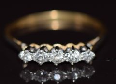 An 18ct gold ring set with five diamonds, 2.4g, size Q