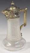 Cut glass claret jug with silver plated mount, hinged lid and mask decoration to the spout, height