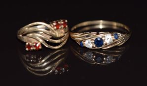 Two 9ct gold rings, one set with garnets and the other sapphires and cubic zirconia, 2.9g, size