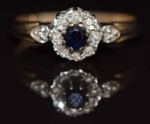 A 9ct gold ring set with a sapphire surrounded by diamonds, 2.3g, size K