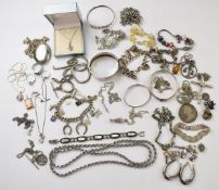 A collection of silver jewellery including 9ct white gold pendant (2.3g), six silver lockets,