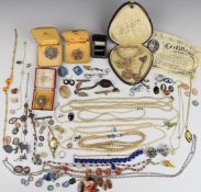 A collection of jewellery including silver brooch set with marcasite and a pearl, brooches, silver