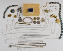 A collection of jewellery including silver chains, necklaces, three 50p coins, silver earrings,