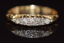 An 18ct gold ring set with five old cut diamonds, 1.8g ,size Q