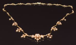 Edwardian 15ct gold necklace set with seed pearls in a floral design, in original box, 16.9g