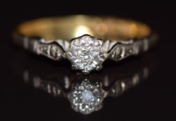 An 18ct gold ring set with a diamond in a platinum setting, 1.9g, size J/K