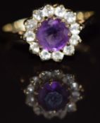 A 9ct gold ring set with an amethyst surrounded by cubic zirconia, 2.5g, size L