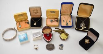 A collection of silver jewellery including St Christopher, opal pendant, fob watch, Paua shell