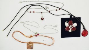 Four Swarovski necklaces and a Swarovski brooch