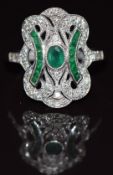 An 18ct white gold ring set with diamonds and emeralds in an Art Deco style, 4.8g, size R