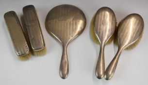 Mappin & Webb hallmarked silver dressing table set comprising hand mirror and four brushes, London