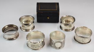 Six various hallmarked silver napkin rings including a pair, Mappin & Webb etc, together with a
