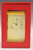 Garrard brass cased carriage clock with white enamel dial, height 16cm, in travel case