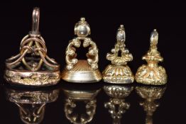 Four Victorian fobs set with bloodstone, citrine and agate, one carved with two 'love' birds