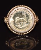 A 9ct gold ring set with a 1982 1/10 gold Krugerrand, 6.9g, size J