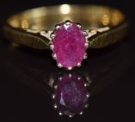 An 18ct gold ring set with an oval cut ruby, 3.8g, size N