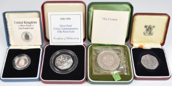 Four Royal Mint proof coins comprising three silver commemorative coins 1972 Silver Wedding crown,
