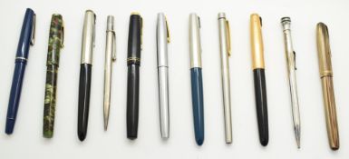 Eleven fountain pens and propelling pencils including Waterman with 14ct gold nib, Parker with 14K