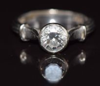 An 18ct white gold ring set with a round brilliant cut diamond of approximately 1ct, 4.7g, size M