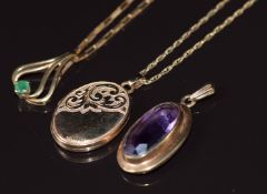 A collection of 9ct gold jewellery comprising locket, pendant set with an emerald, pendant set