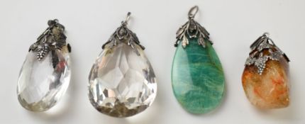 Four Arts & Crafts silver pendants set with paste and quartz