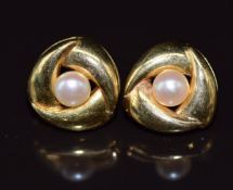 A pair of 18ct gold earrings set with a pearl to each, 1.6g 1.2cm