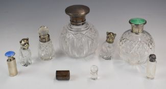 Hallmarked silver and similar topped bottles, to including two guilloché enamel examples and a