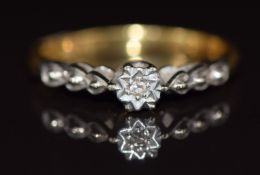 An 18ct gold ring set with a diamonds in a platinum setting, 2.6g, size L