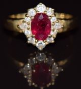 An 18ct gold ring set with an oval cut ruby of approximately 1ct surrounded by round and marquise