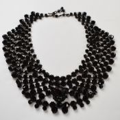 A 19thC French jet collar necklace stamped 'made in Austria'