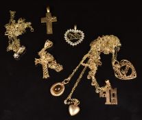 Nine 9ct gold pendants including 'mum', 'sister', crosses and heart, and nine 9ct gold chains, 9.2g