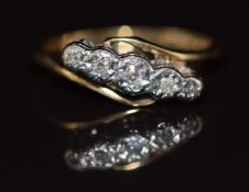 An 18ct gold ring set with five diamonds in a platinum setting, size J, 2.3g