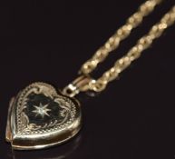 A 9ct gold heart locket set with a diamond, on 9ct gold chain, 9.4g