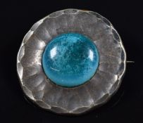 Arts & Crafts pewter brooch set with a cabochon, probably Ruskin, 'The Guild Button N and E.G'