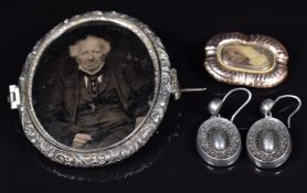 A pair of Victorian silver earrings with foliate decoration, Victorian silver locket and Victorian