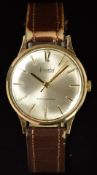 Accurist 9ct gold gentleman's wristwatch with gold hands and baton hour markers, silver dial and