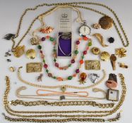 A collection of costume jewellery including Sarah Coventry and Monet brooches, coral necklace,