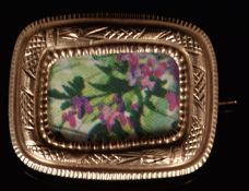 Victorian 9ct rose gold brooch with an engraved serpent border, 4.2g