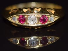 A c1900 18ct gold ring set with rubies and diamonds, 2.8g, size O