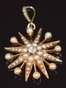 Edwardian 9ct gold pendant in the form of a star set with a diamond and seed pearls, 4.2g