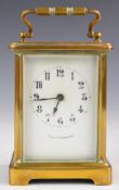 19th or early 20thC brass cased carriage clock, with retailer's name to the white enamel dial,