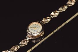 A 9ct gold ribbon bracelet (0.9g 17.5cm) and a 9ct gold watch on rolled gold bracelet (10.6g 14.