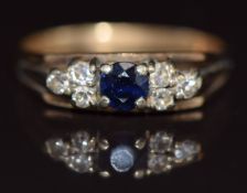 A 9ct gold ring set with a sapphire and diamonds, 2.5g, size M