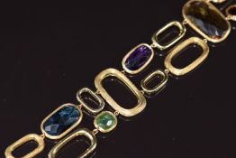 An 18ct gold bracelet by Marco Bicego set with amethyst, blue topaz, citrine, garnet and
