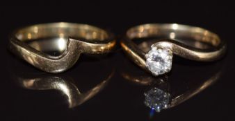 An 18ct gold ring set with a round brilliant cut diamond of approximately 0.2ct, with an 18ct gold