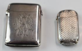 Two Victorian hallmarked silver vesta cases, one engine turned but with indistinct marks, the